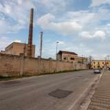 Ma ci sono anche due oleifici, uno in funzione e l'altro, il Sapio, con la sua lunghissima ciminiera, chiuso da anni